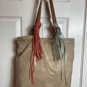 The SAK leather khaki bucket shoulder bag turquoise green &orange fringe accents